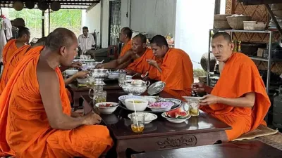 An Binh Islet Tour | A Scenic Mekong River Escape from Can Tho - Monks in traditional saffron robes performing a ceremony at Phu Ly Pagoda for guests of the Me Kong Smile tour - 18705