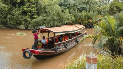 An Binh Islet Tour | A Scenic Mekong River Escape from Can Tho - Navigating a narrow, lush green canal in Vinh Long on the Me Kong Smile boat tour - 18707