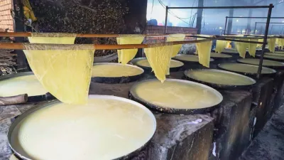 An Binh Islet Tour | A Scenic Mekong River Escape from Can Tho - Sheets of fresh tofu skin hanging to dry in the traditional method at a Vinh Long workshop - 18708