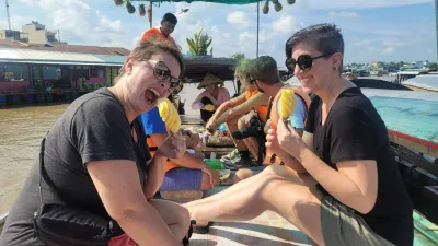 TOUR PROGRAMONE DAY MEKONG DELTA: MY THO – BEN TRE - Tasting fresh pineapples bought directly from a vendor boat at Cai Rang Floating Market - 18740